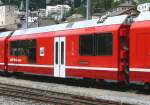RhB - Bi 356.05 Zweisystem-Triebzug - Zwischenwagen am 25.07.2010 in St.Moritz - Logo Graub�nden in r�toromanisch  